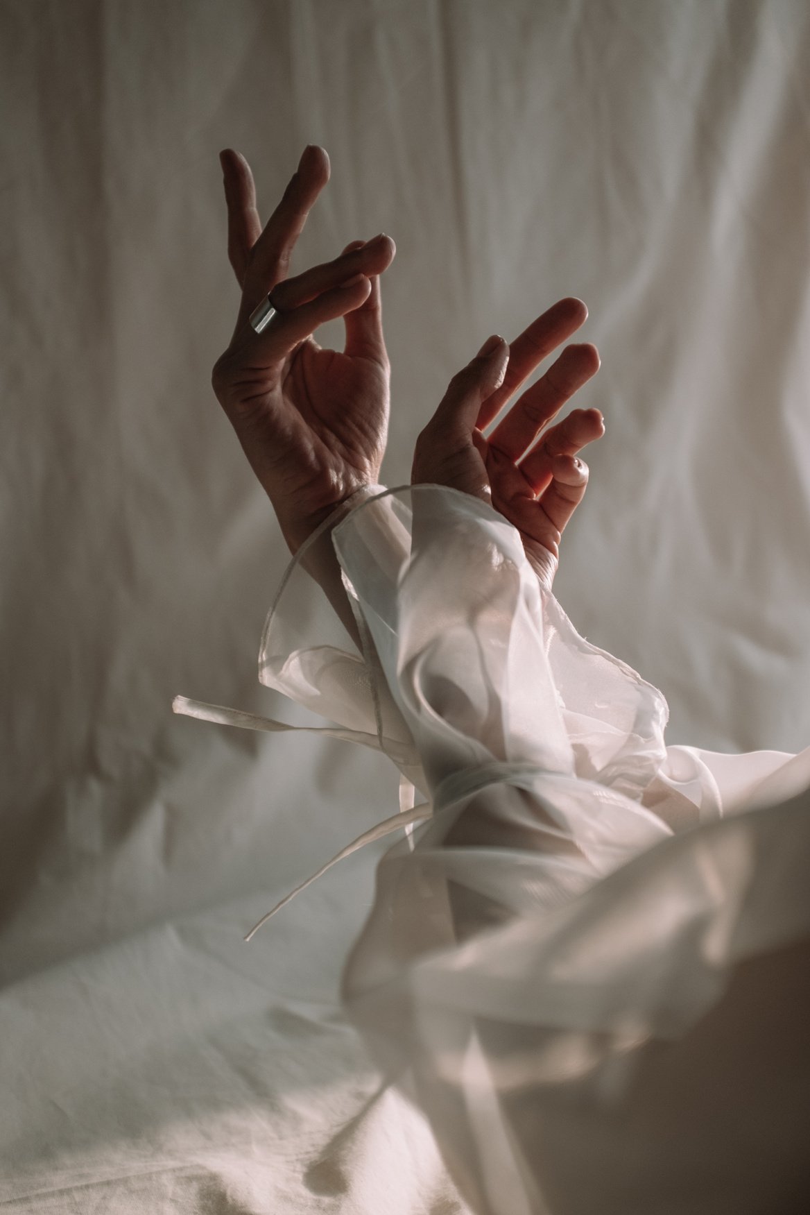 White Textile on Persons Hand